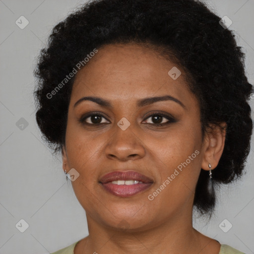 Joyful black adult female with short  brown hair and brown eyes
