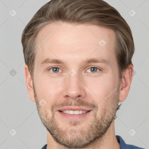 Joyful white adult male with short  brown hair and grey eyes