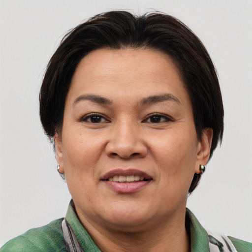 Joyful asian adult female with short  brown hair and brown eyes