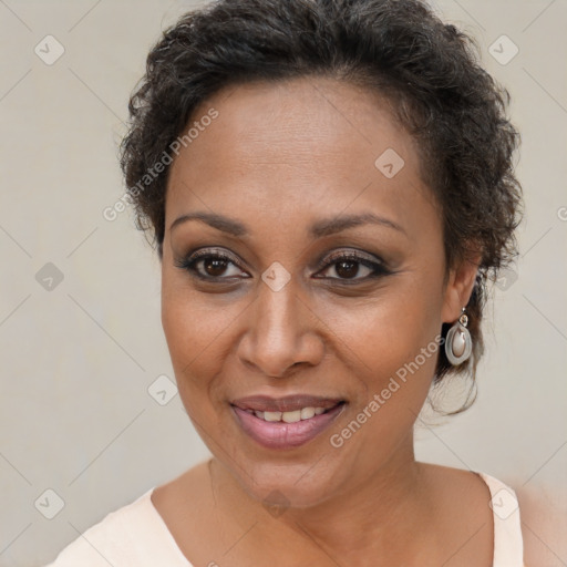 Joyful black adult female with short  brown hair and brown eyes