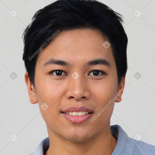 Joyful asian young-adult male with short  black hair and brown eyes