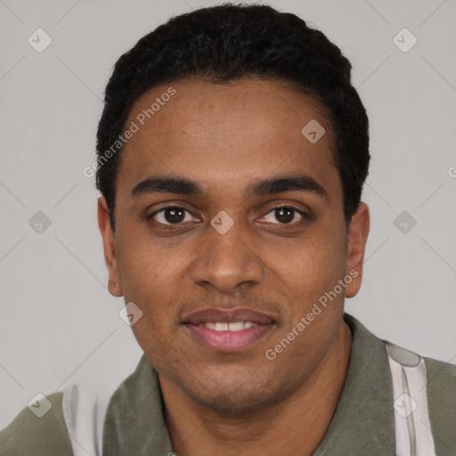 Joyful black young-adult male with short  black hair and brown eyes