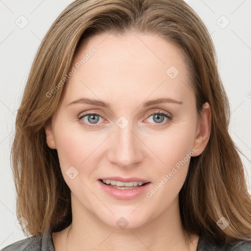 Joyful white young-adult female with long  brown hair and blue eyes