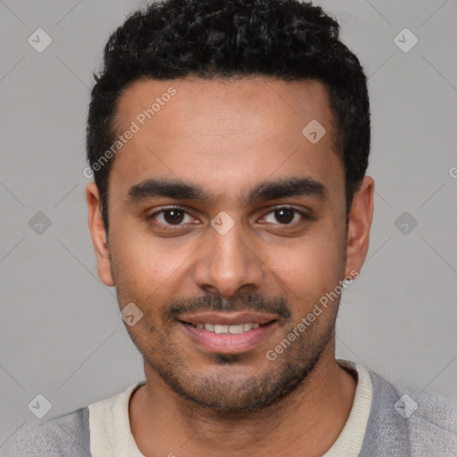 Joyful white young-adult male with short  black hair and brown eyes