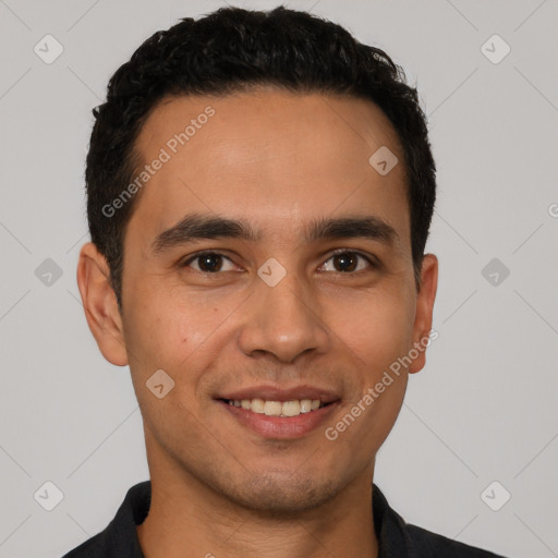 Joyful white young-adult male with short  black hair and brown eyes