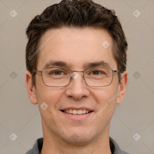 Joyful white adult male with short  brown hair and grey eyes