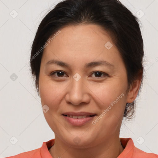 Joyful white adult female with medium  brown hair and brown eyes