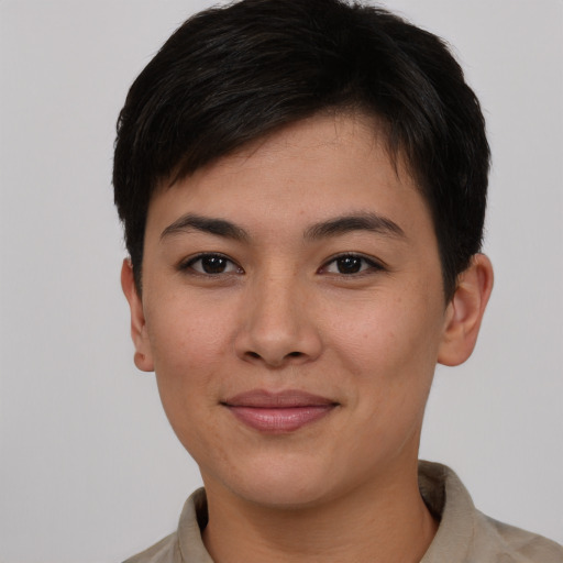 Joyful asian young-adult female with short  brown hair and brown eyes