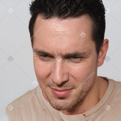 Joyful white adult male with short  brown hair and brown eyes