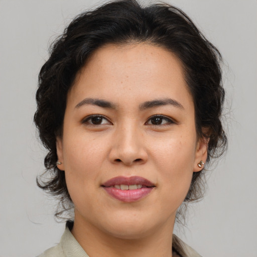 Joyful asian young-adult female with medium  brown hair and brown eyes