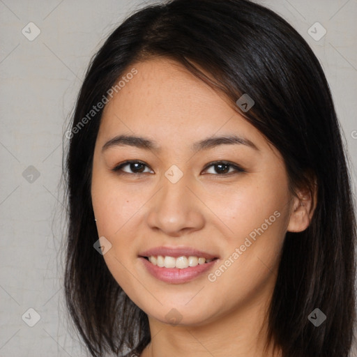 Joyful asian young-adult female with long  brown hair and brown eyes