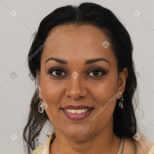 Joyful latino adult female with medium  brown hair and brown eyes