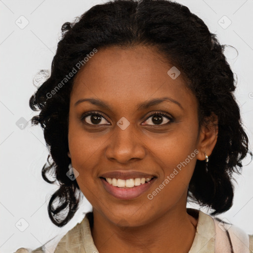 Joyful black young-adult female with medium  brown hair and brown eyes