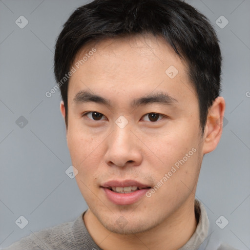 Neutral asian young-adult male with short  brown hair and brown eyes