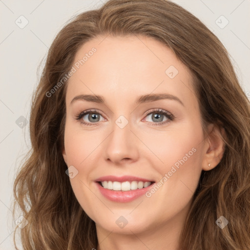 Joyful white young-adult female with long  brown hair and green eyes