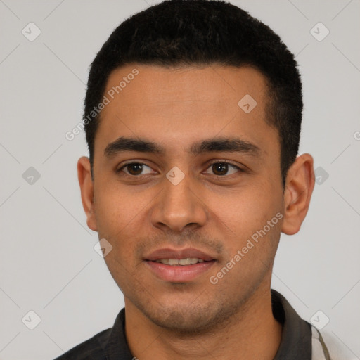 Joyful white young-adult male with short  black hair and brown eyes