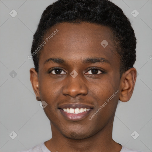 Joyful black young-adult male with short  brown hair and brown eyes