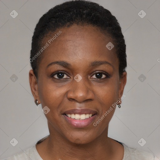 Joyful black young-adult female with short  black hair and brown eyes