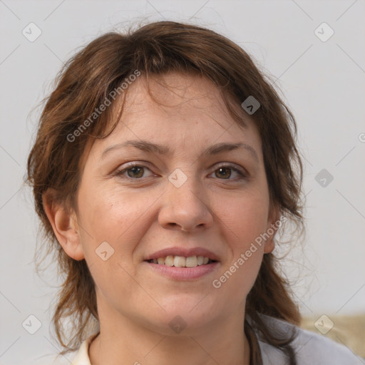 Joyful white adult female with medium  brown hair and brown eyes