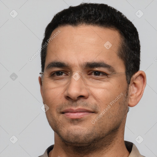 Joyful white young-adult male with short  black hair and brown eyes