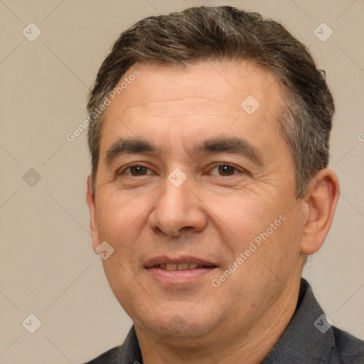 Joyful white adult male with short  brown hair and brown eyes