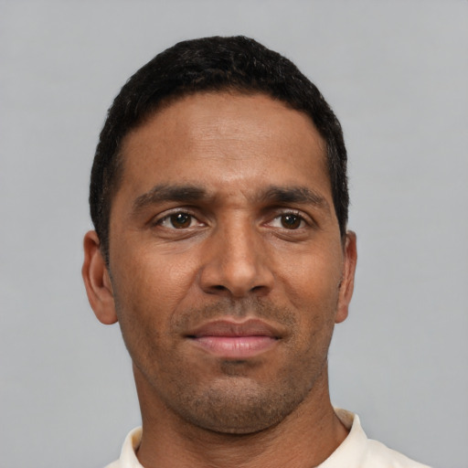 Neutral black young-adult male with short  black hair and brown eyes