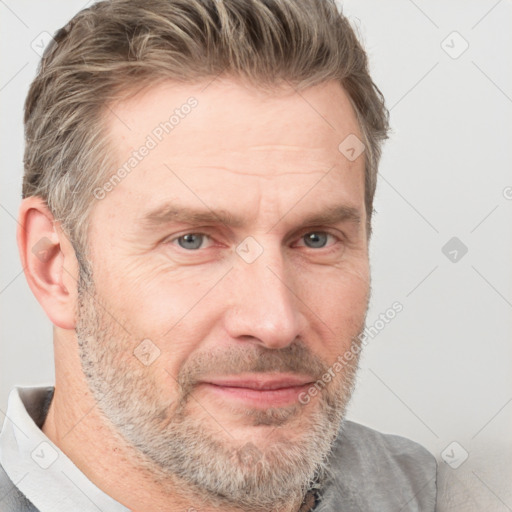 Joyful white adult male with short  brown hair and grey eyes