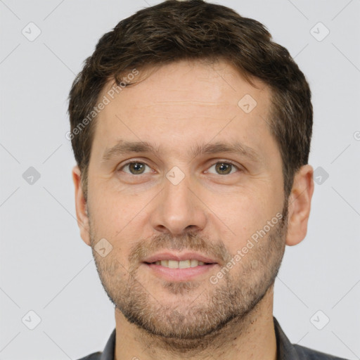 Joyful white adult male with short  brown hair and brown eyes