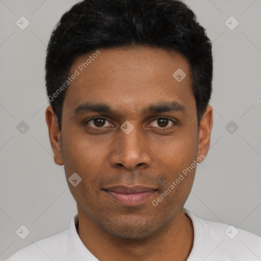 Joyful black young-adult male with short  black hair and brown eyes