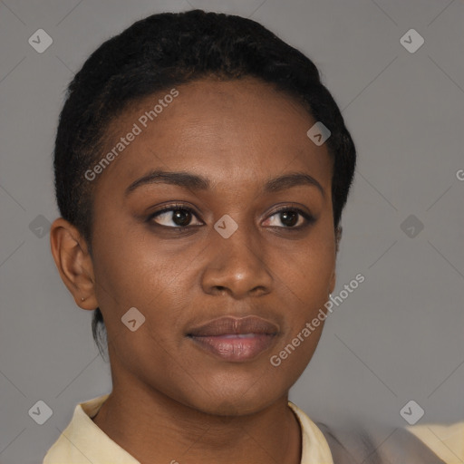 Joyful black young-adult female with short  brown hair and brown eyes