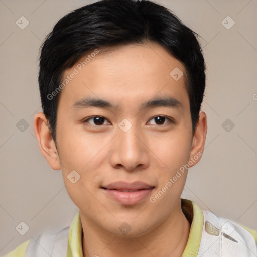 Joyful asian young-adult male with short  brown hair and brown eyes