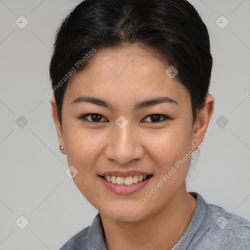 Joyful asian young-adult female with short  brown hair and brown eyes