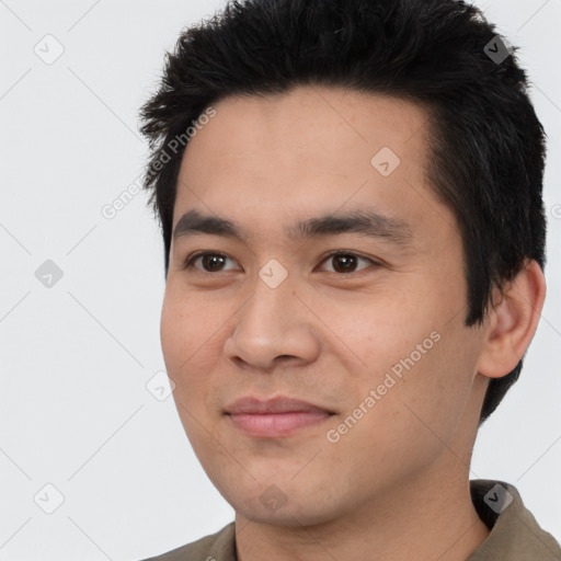 Joyful white young-adult male with short  black hair and brown eyes