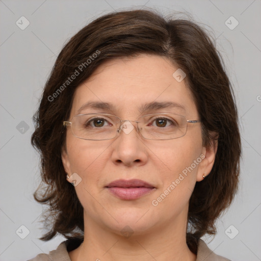 Joyful white adult female with medium  brown hair and grey eyes