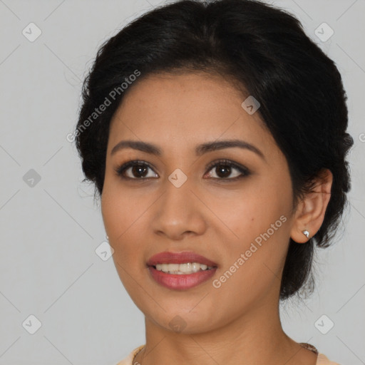 Joyful latino young-adult female with medium  brown hair and brown eyes