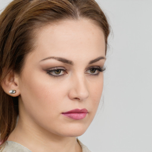 Neutral white young-adult female with medium  brown hair and green eyes