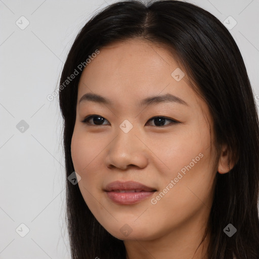 Joyful asian young-adult female with long  brown hair and brown eyes