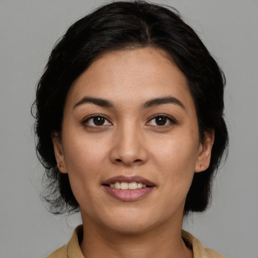 Joyful asian young-adult female with medium  brown hair and brown eyes