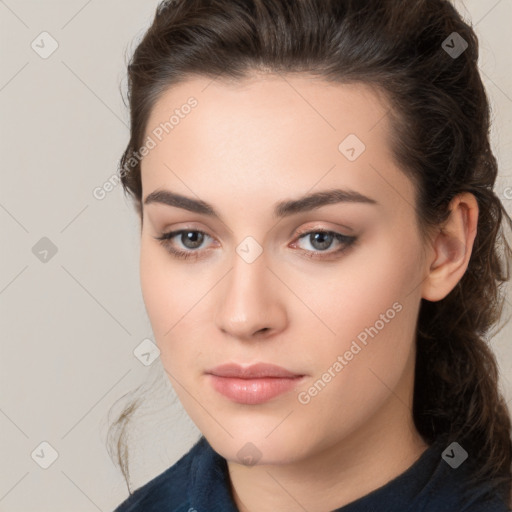 Neutral white young-adult female with long  brown hair and brown eyes