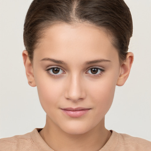 Joyful white child female with short  brown hair and brown eyes