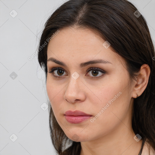 Neutral white young-adult female with long  brown hair and brown eyes