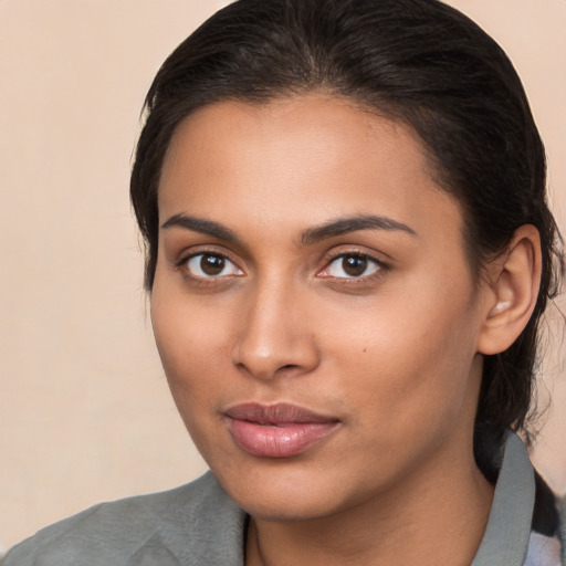 Neutral latino young-adult female with medium  brown hair and brown eyes