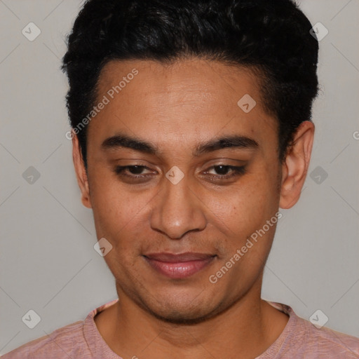 Joyful latino young-adult male with short  black hair and brown eyes