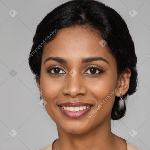 Joyful black young-adult female with medium  black hair and brown eyes