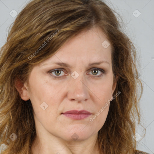 Joyful white adult female with long  brown hair and brown eyes