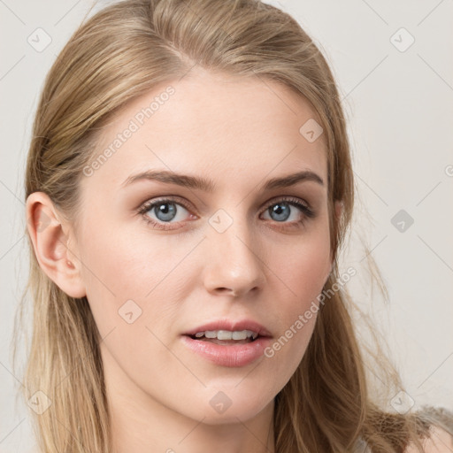 Joyful white young-adult female with long  brown hair and blue eyes