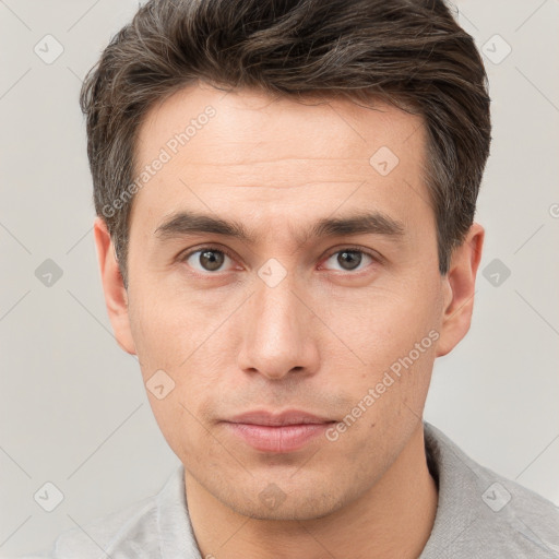 Neutral white young-adult male with short  brown hair and grey eyes