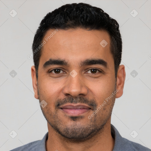 Joyful latino young-adult male with short  black hair and brown eyes