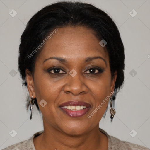 Joyful black adult female with short  brown hair and brown eyes