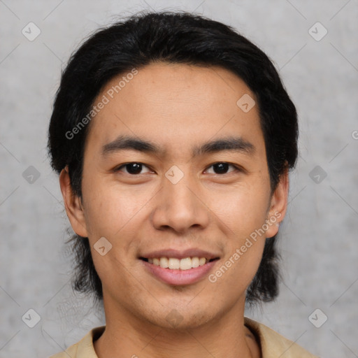 Joyful latino young-adult male with short  black hair and brown eyes